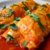 Two sweet potato enchiladas on a plate