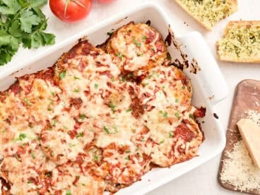 Overhead view of an eggplant parmesan in a baking dish.