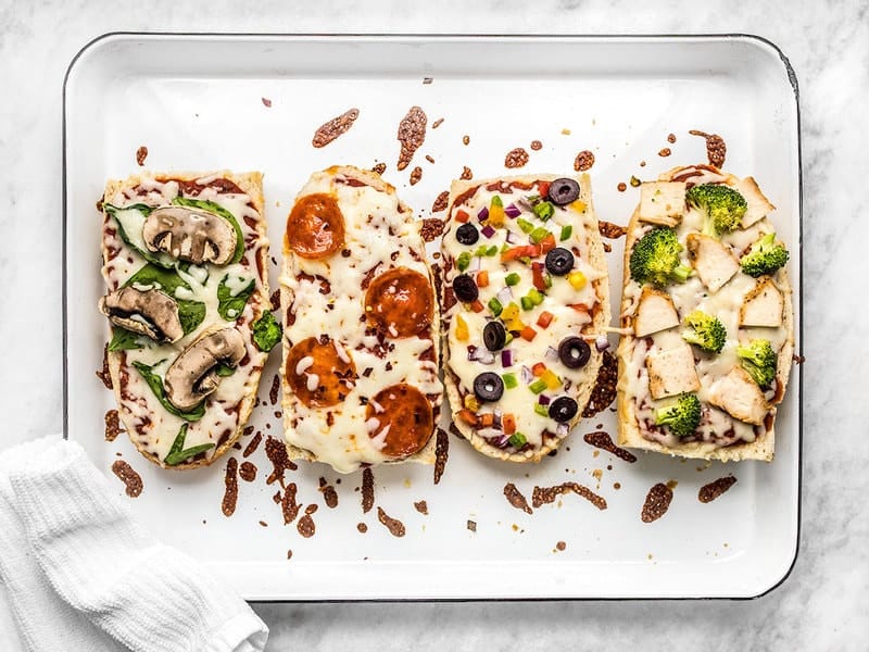 French Bread Pizza is the perfect budget-friendly fast and easy weeknight dinner. Customize the toppings to fit your taste buds or what you have on hand! Budgetbytes.com Baked French Bread Pizza