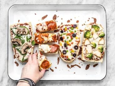 French Bread Pizza is the perfect budget-friendly fast and easy weeknight dinner. Customize the toppings to fit your taste buds or what you have on hand! Budgetbytes.com