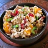 Angle view of holiday rice pilaf in a bowl.