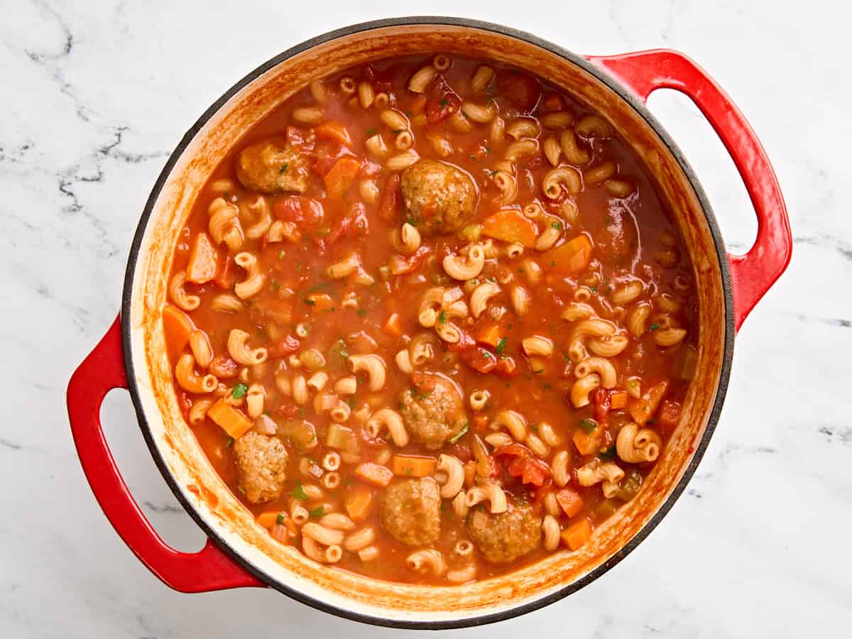 Finished homemade meatball soup in a pot.