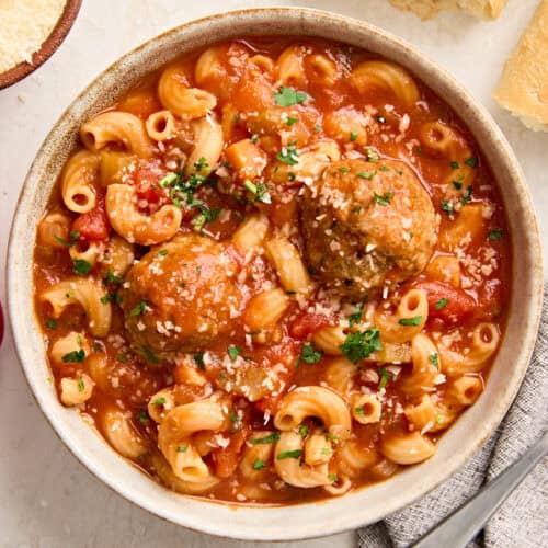 Overhead view of a bowl of hearty meatball soup.