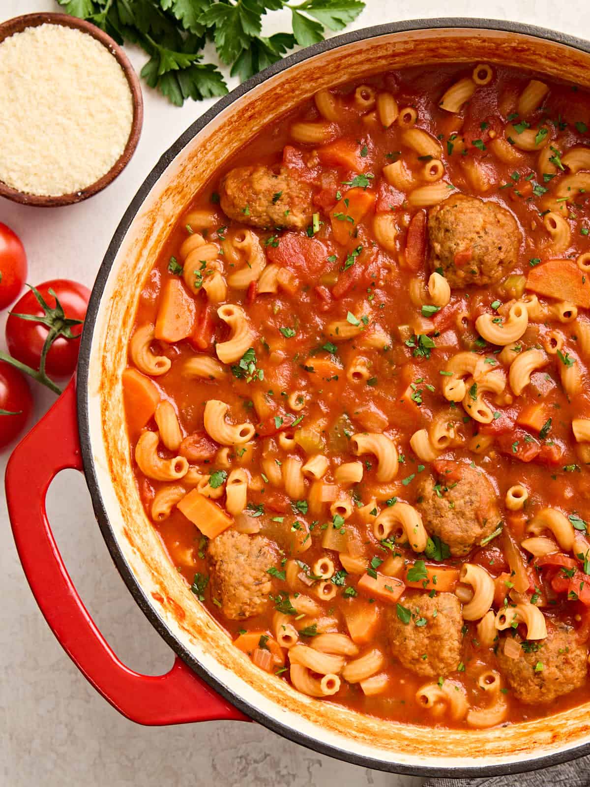 Overhead view of a pot of hearty meatball soup.