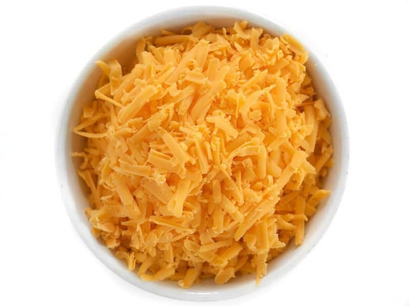 Top view of a bowl of Shredded Cheddar cheese
