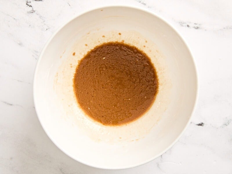 Marinade for kung pao chicken in a bowl.