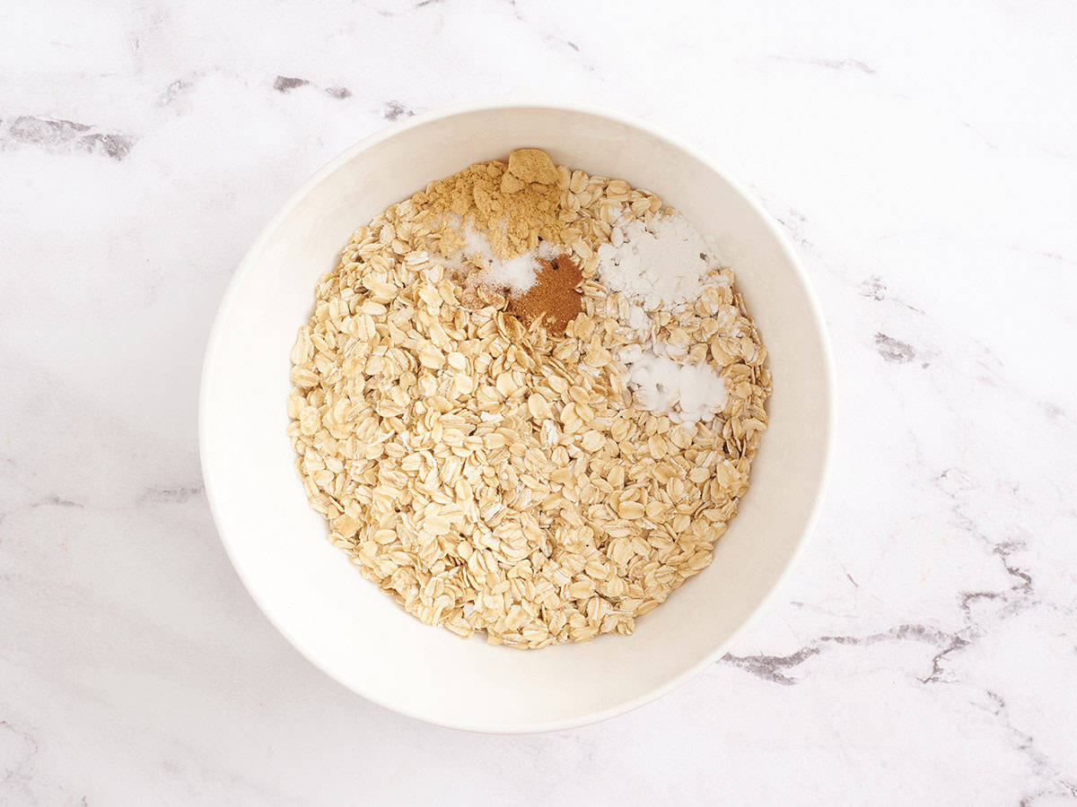 Oats and seasonings in a mixing bowl.