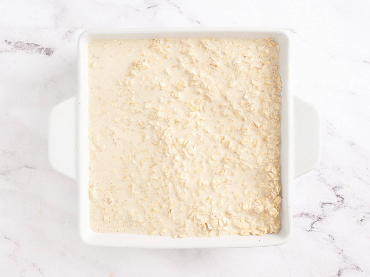 Oatmeal in a baking dish for baked oatmeal.