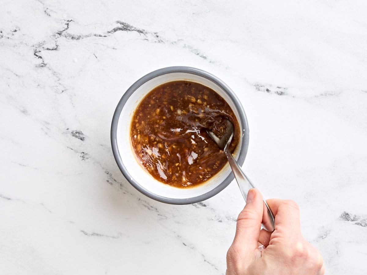 A homemade teriyaki marinade being mixed in a bowl.