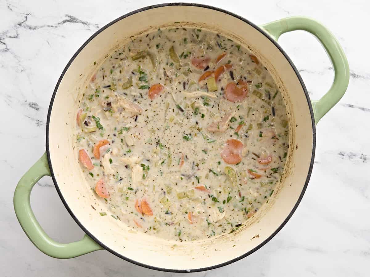 Finished creamy chicken and rice soup in a pot.
