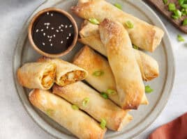 Overhead view of homemade vegetable egg rolls on a plate.