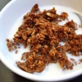 Gingerbread baked oatmeal served in a bowl with milk.