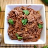 Shredded taco beef from above with coriander.