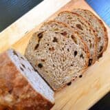 Diagonal slice of spiced bread on a cutting board.