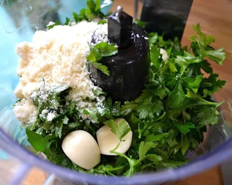 Parsley pesto ingredients in the food processor.