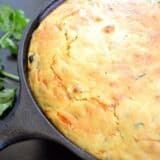 Vegetable tamale pie served on a cast iron pan.