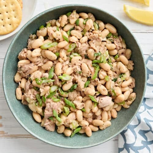 Overhead view of a bowl of tuna and white bean salad.