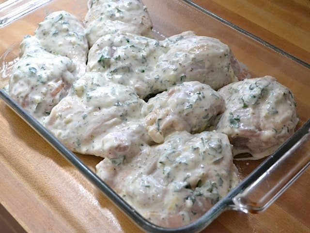 marinated chicken placed in baking dish ready to bake