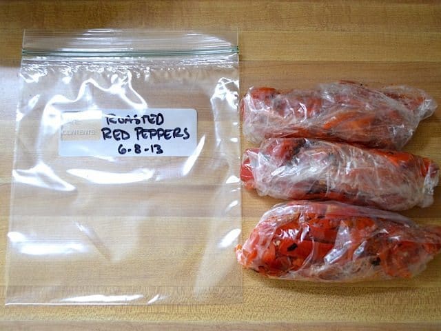 peppers divided up and placed into zip lock bags to freeze