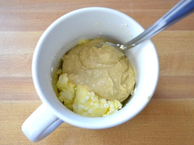 Add Hummus to cooked eggs in mug