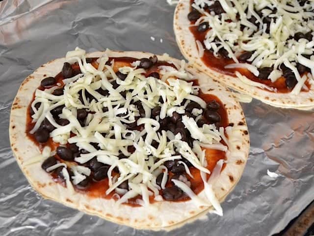 shredded cheese sprinkled on top of black beans