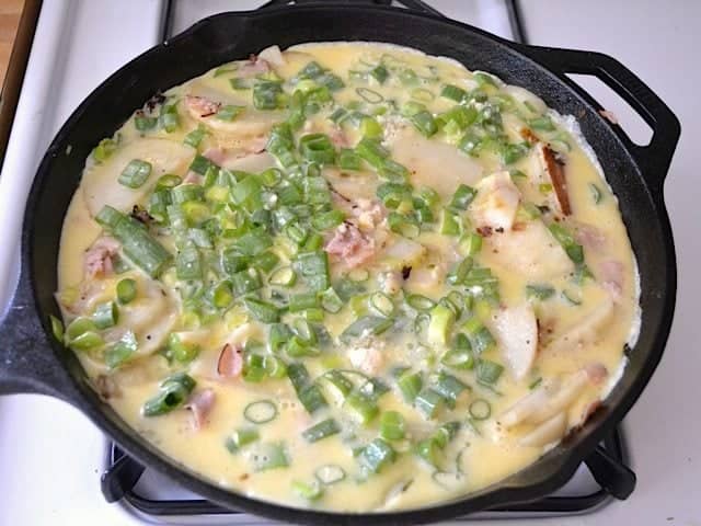 Eggs setting in skillet