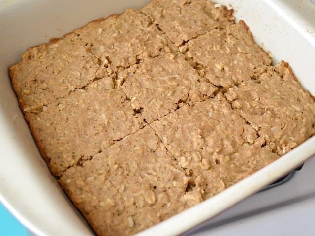 Cooked and cooled bars cut into 9 squares in baking dish
