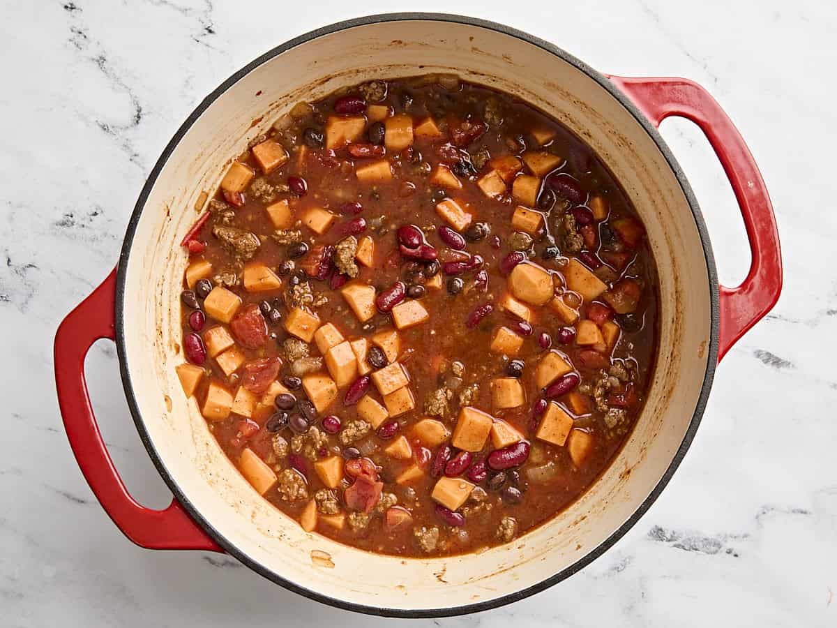 Chorizo sweet potato chilli in a pot before simmering.