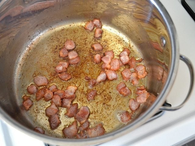 Crispy pieces of bacon in bottom of pot