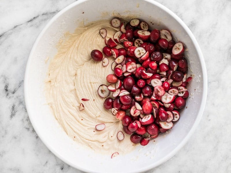 Cranberries added to mixing bowl to be folded into batter