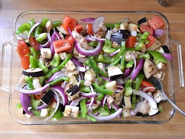 Marinade poured over top veggies in baking dish