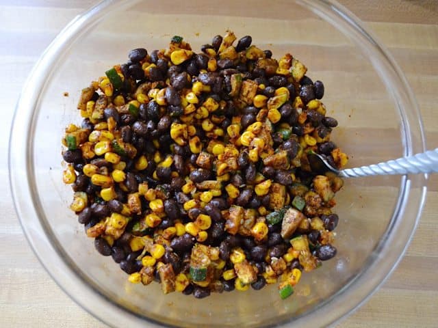 Roasted veggies put back in mixing bowl and black beans added