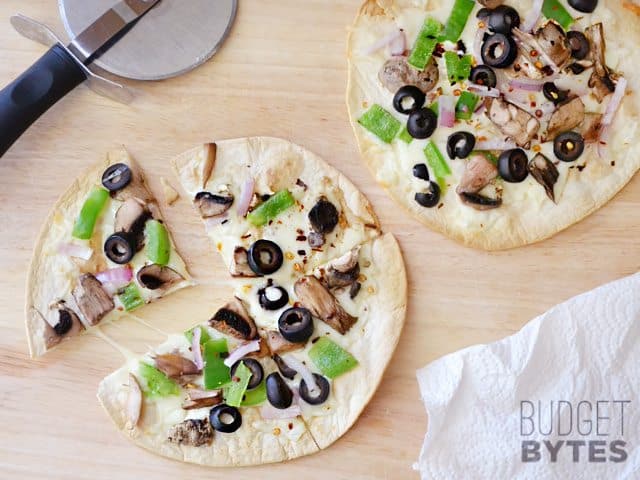 Cut Quick Fix Salad Bar Pizza with pizza cutter