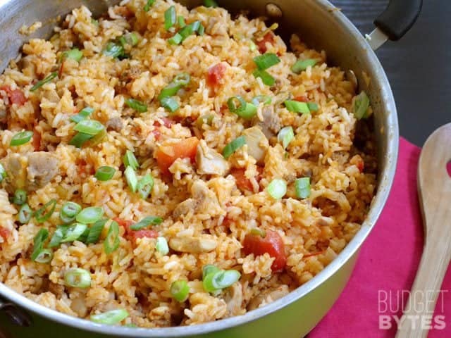 Finished Chorizo Chicken Jambalaya in pot with wooden spoon on the side