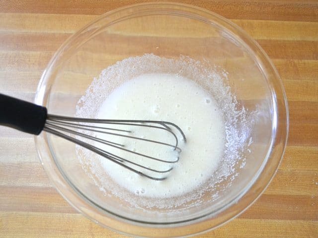 Marshmallow mixture in mixing bowl with whisk
