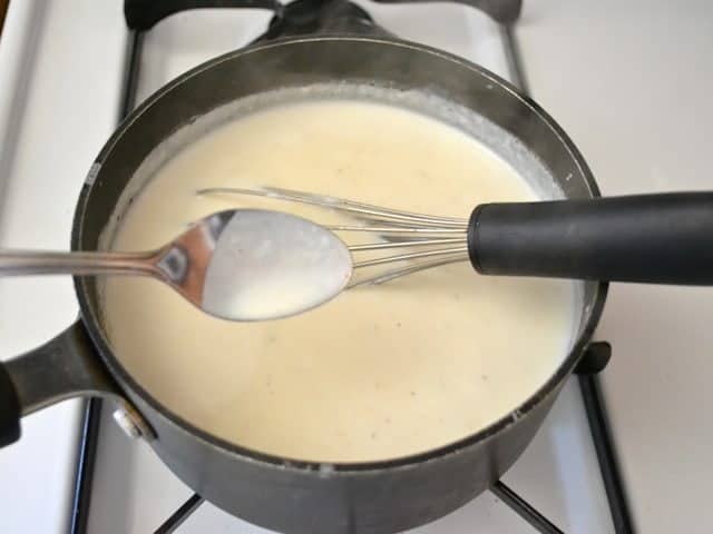 Thickened sauce on spoon
