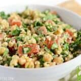 A close-up of falafel salad with fresh vegetables.