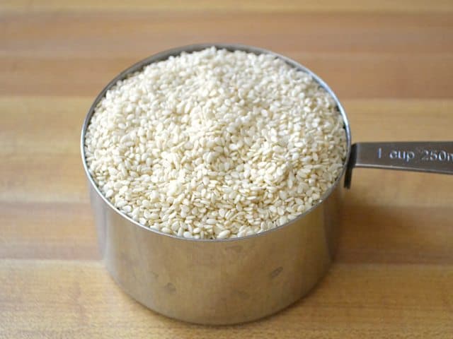 Sesame Seeds in measuring cup