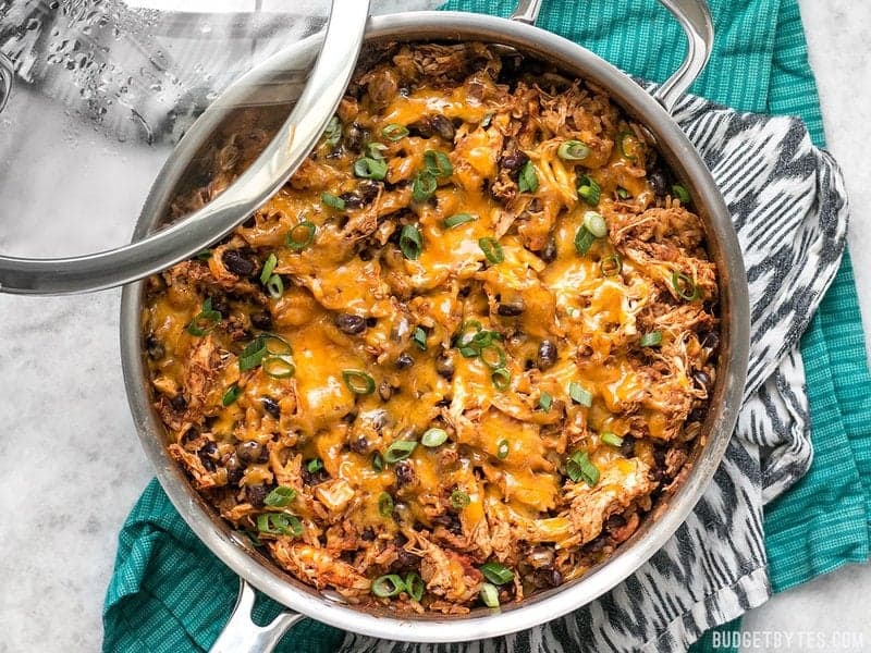 If you're looking for a quick and easy dinner, this Southwest Chicken Skillet is it! Precooked chicken makes this dinner possible in about 30 minutes. BudgetBytes.com Shredded cheese sprinkled on top of skillet and melted