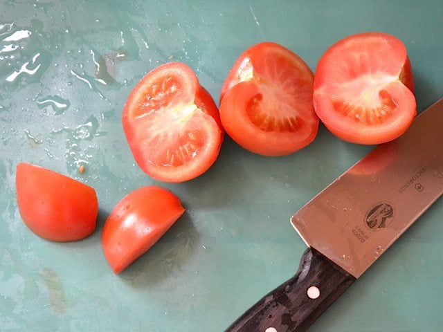 Dicing tomatoes with knife