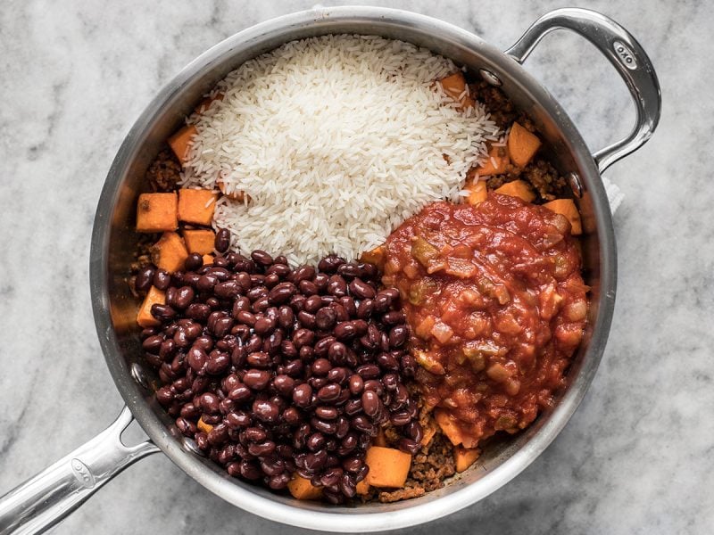 Beans, Rice and Salsa added to other ingredients in skillet