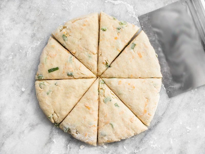 Cheddar Scallion Scones cut into triangles