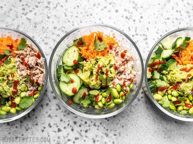 These super fresh and Spicy Tuna Guacamole bowls are packed with protein, fiber, and flavor. The perfect no-reheat meal prep lunch for summer! Budgetbytes.com Meal prepped Spicy Tuna Guacamole Bowls in round glass containers