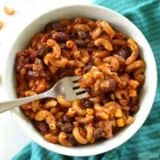One Pot Chili Pasta is fast, easy, full of good-for-you beans and vegetables, and just enough cheese to feel like comfort food. BudgetBytes.com
