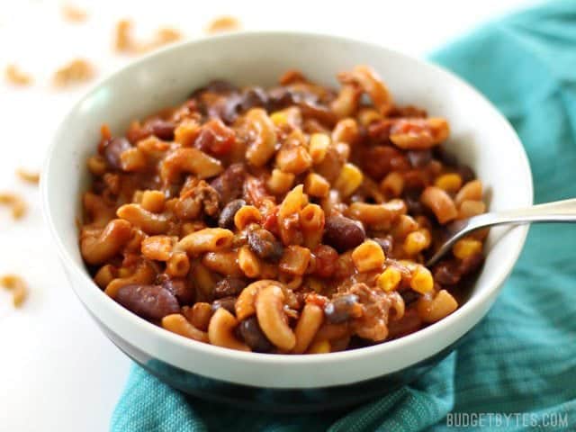 This super hearty One Pot Chili Pasta is bursting with southwest chili flavor, protein, and fiber. It's a meal in a bowl that the whole family will love. Budgetbytes.com Front view of a bowl of One Pot Chili Pasta