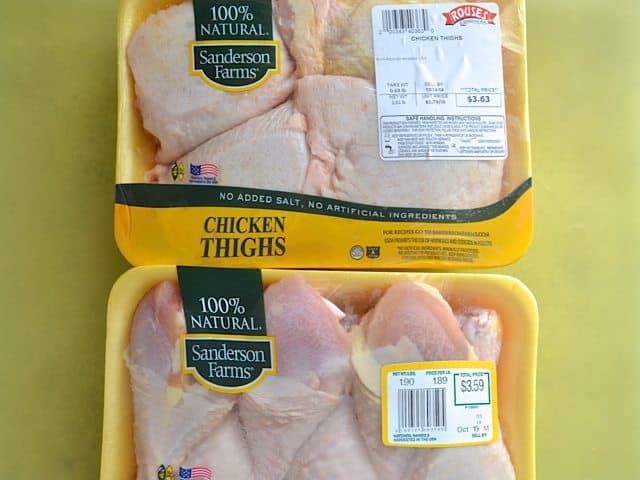Package of chicken thighs and package of chicken legs