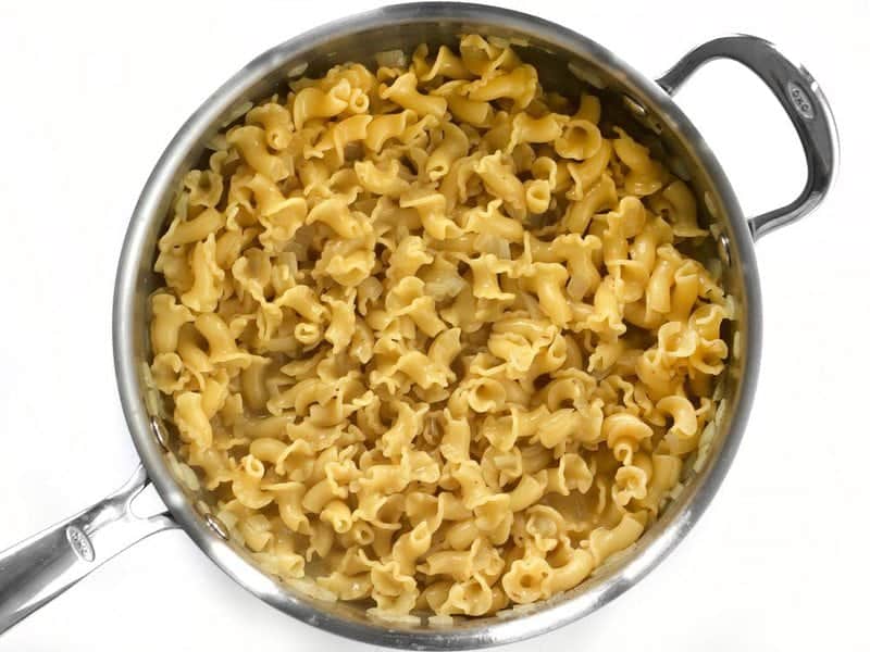 Cooked pasta in skillet, broth absorbed
