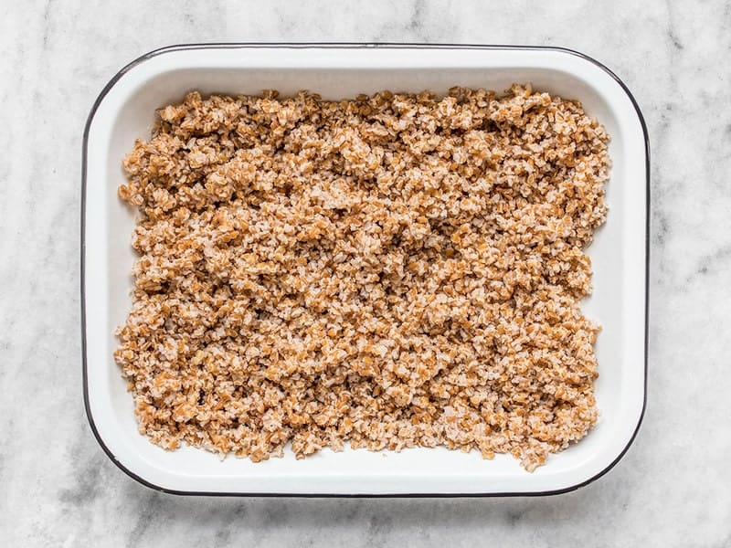Cooked bulgar in bottom of dish