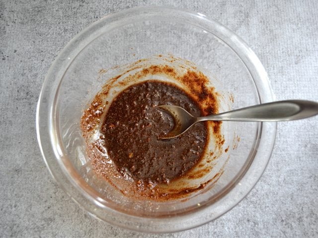 Five Spice Rub ingredients in bowl with spoon