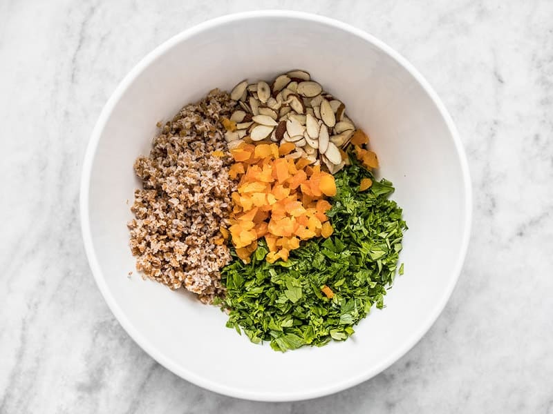 Parsley Salad Ingredients (bulgar, apricots, almonds and parsley) in bowl